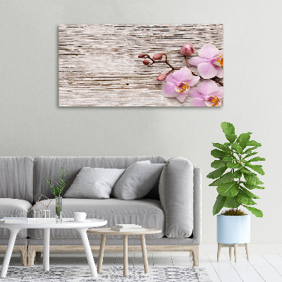 Foto obraz na płótnie Orchidea na drewnie