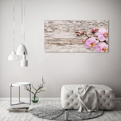 Foto obraz na płótnie Orchidea na drewnie
